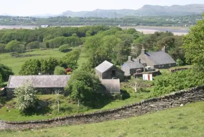 an aerial view of a farm with houses and trees at Bryn Derw in Talsarnau
