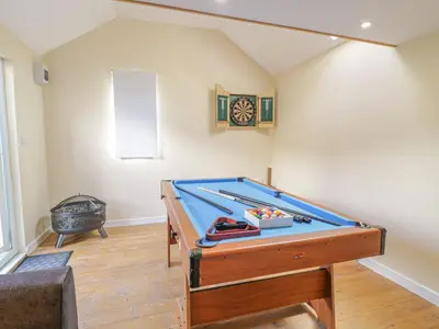 a room with a pool table in a room at 1 Rhys Terrace in Pennal