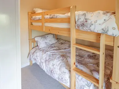 a couple of bunk beds in a room at 1 Rhys Terrace in Pennal