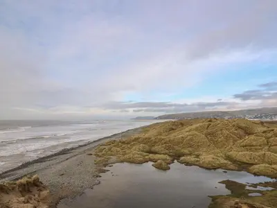 an aerial view of the beach and the ocean at McAuliffe Lodge in Borth