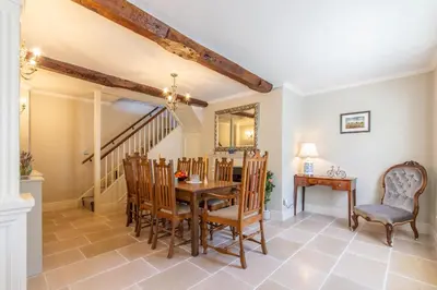a dining room with a table and chairs at Turford House, Ludlow in Ludlow