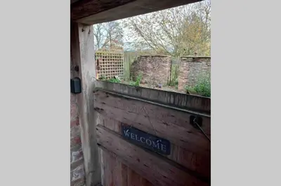 a sign on the side of a wooden door at Upper Heath Farm - Stable Cottage Ludlow in Craven Arms