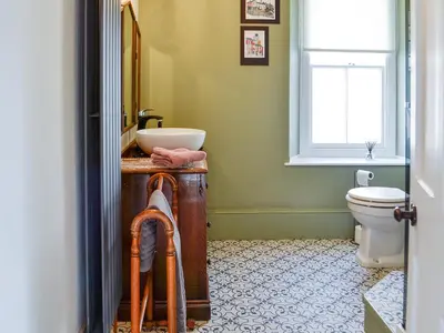 a bathroom with a sink and a toilet at The Mill House, The Square in Talgarth