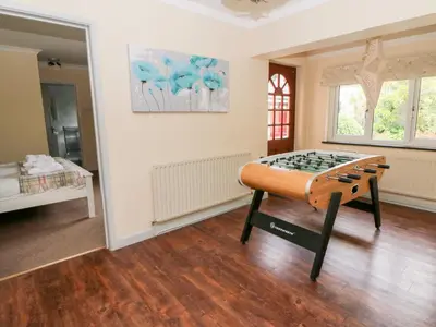 a room with a bed in the middle of a room at Tynewydd Fields in Lampeter