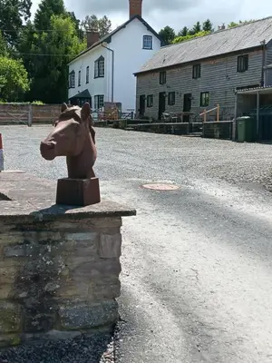a statue of a horse on the side of a road at The Calf Cotts in Pembridge