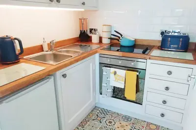 a kitchen with a sink and a dishwasher at Cosy, elegant apartment in heart of Ludlow Town in Ludlow