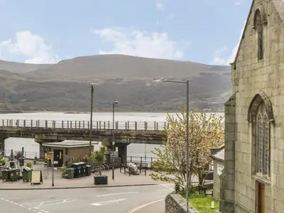 a view of a bridge over a body of water at Sapphire Suite in Barmouth