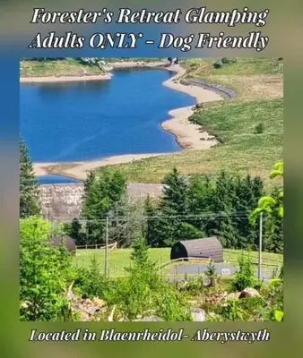 a picture of a lake with the words forestiers natural climbing adults only dogs at Forester's Retreat Glamping - Cambrian View- Vaccinated dogs over the age of 2 are accepted in Aberystwyth