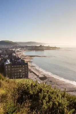 a view of a beach and the ocean at Fferm Penglais Apartments in Aberystwyth