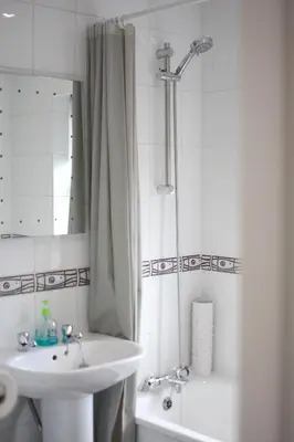 a bathroom with a sink and a shower and a toilet at 2 bed house, walking distance Shrewsbury centre in Shrewsbury