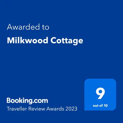 a blue screen with the text awarded to mil wood coffee at Milkwood Cottage in Corwen