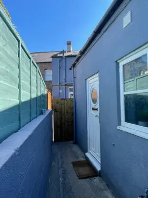 a blue building with a door and a window at Westend Holiday Room 4 Brecon in Brecon