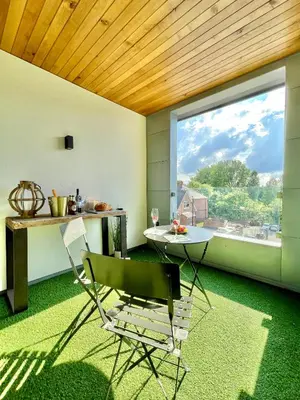 a room with a table and a chair and a window at Apartment Twelve in Shrewsbury