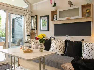 a living room with a couch and a table at Jacob's Meadow Pod 2 in Shrewsbury