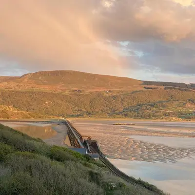 a view of a river with a hill in the background at No6 in Barmouth