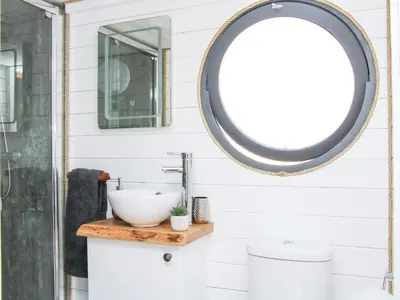 a bathroom with a sink and a mirror at Cherry Blossom in Craven Arms