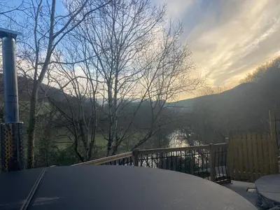 a table on a balcony with a view of a valley at Avondale in Llangollen
