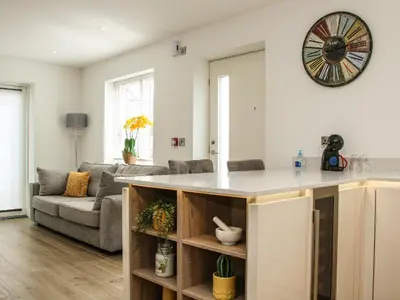 a kitchen and living room with a large counter top at 42 Albury Place in Shrewsbury