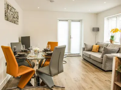 a living room with a table and chairs and a couch at 42 Albury Place in Shrewsbury