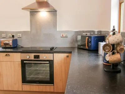 a kitchen with a stove and a counter top at Toot View in Ludlow