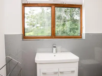 a bathroom with a sink and a window at Toot View in Ludlow