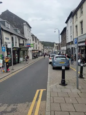 a street with cars parked on the side of the road at Large 5 bed town-centre home close to the beach, sleeps 9 in Aberystwyth