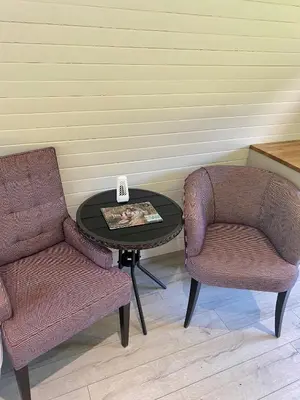 two chairs and a table in a room with a table and two chairs at The Pod in Aberystwyth