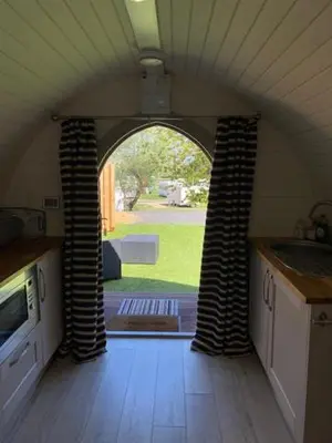 a kitchen with an archway in a house at The Pod in Aberystwyth