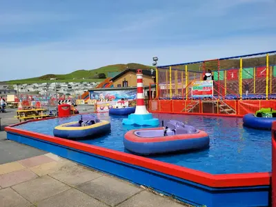 a water park with three inflatable tubes in the water at Gloria Stay - Aberystwyth Caravan in Aberystwyth