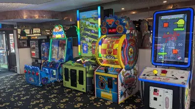 a group of arcade games in a room at Gloria Stay - Aberystwyth Caravan in Aberystwyth