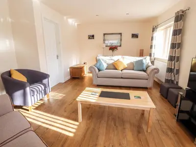 a living room with a couch and a coffee table at Awel Y Berwyn in Oswestry