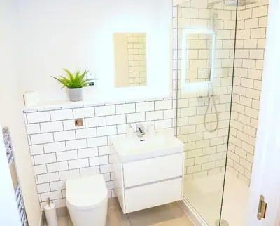 a bathroom with a toilet and a sink and a shower at Shrewsbury apartments by BEVOLVE - Free Parking in Shrewsbury