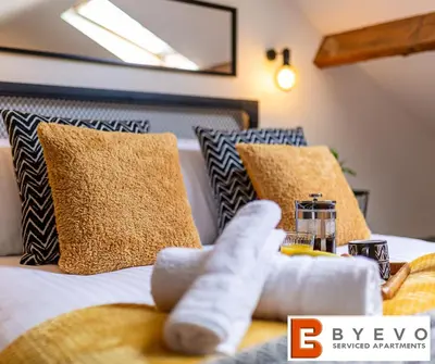 a close up of a bed with pillows at ByEvo Oswestry Barn - Quirky romantic retreat or Cosy contractor base in Oswestry