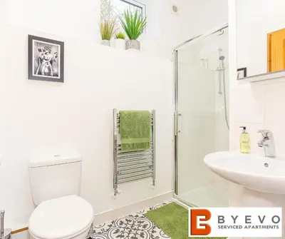 a bathroom with a shower and a toilet and a sink at ByEvo Oswestry Barn - Quirky romantic retreat or Cosy contractor base in Oswestry