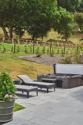 two benches and a fire pit in a park at Shepherds Rest in Llandyssil