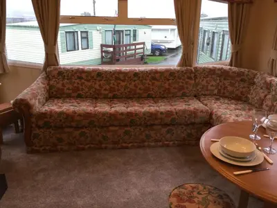 a living room with a couch and a table at D19 in Aberystwyth