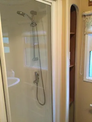 a bathroom with a shower and a sink at D19 in Aberystwyth