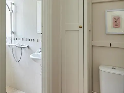 a bathroom with a toilet and a sink at Green Acres in Llangollen