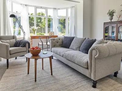 a living room with a couch and a table at Green Acres in Llangollen