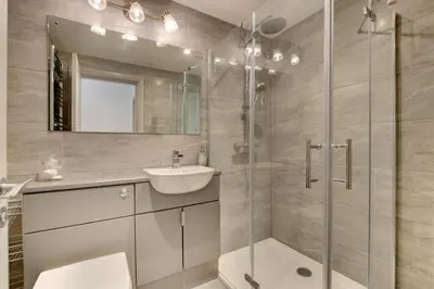 a bathroom with a shower and a sink and a mirror at 2 Bed in Aberystwyth oc-bow200 in Aberystwyth