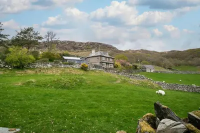 a house on a hill with a green field at 4 Bed in Barmouth oc-bow259 in Barmouth