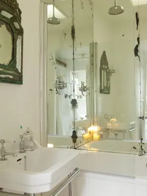 a white bathroom with a sink and a mirror at The Pavement Palace in Hay-on-Wye