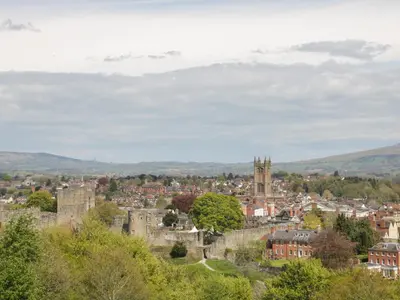 a cityscape of a town with a castle at 55 Corve Street in Ludlow