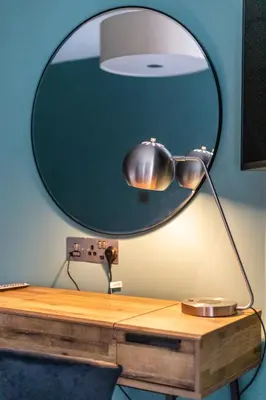 a desk with a mirror on top of a desk at Ty Belgrave - Apartment 3 in Aberystwyth