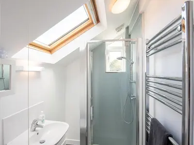 a bathroom with a shower and a sink at Top House in Forden
