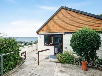 a small house with a view of the ocean at Frondeg in Aberaeron