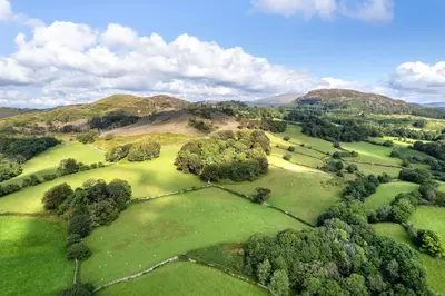 an overhead view of a golf course with trees and hills at 1 Bed in Dolgellau oc-bow292 in Dolgellau
