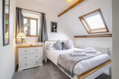 a bedroom with a bed and a window at 2 Bed in Cray oc-bow287 in Cray