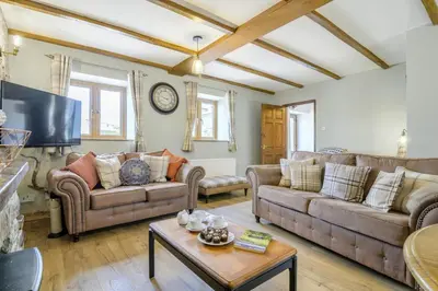 a living room with two couches and a table at 2 Bed in Cray oc-bow287 in Cray