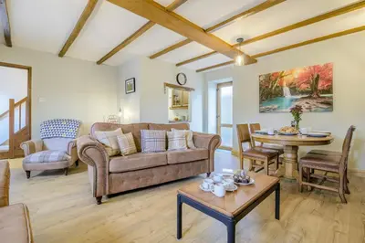 a living room with a couch and a table at 2 Bed in Cray oc-bow287 in Cray